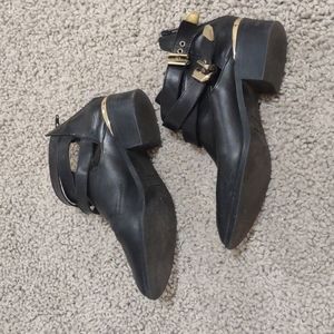Black shoes with gold detail